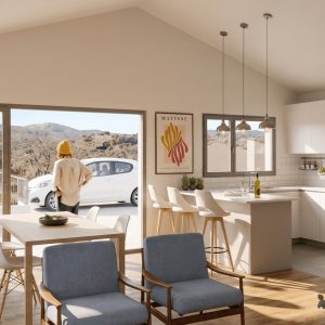 Diseño de interior de concepto abierto con cocina blanca integrada, techo inclinado y gran ventanal con vistas a la Sierra de Madrid en una vivienda unifamiliar.