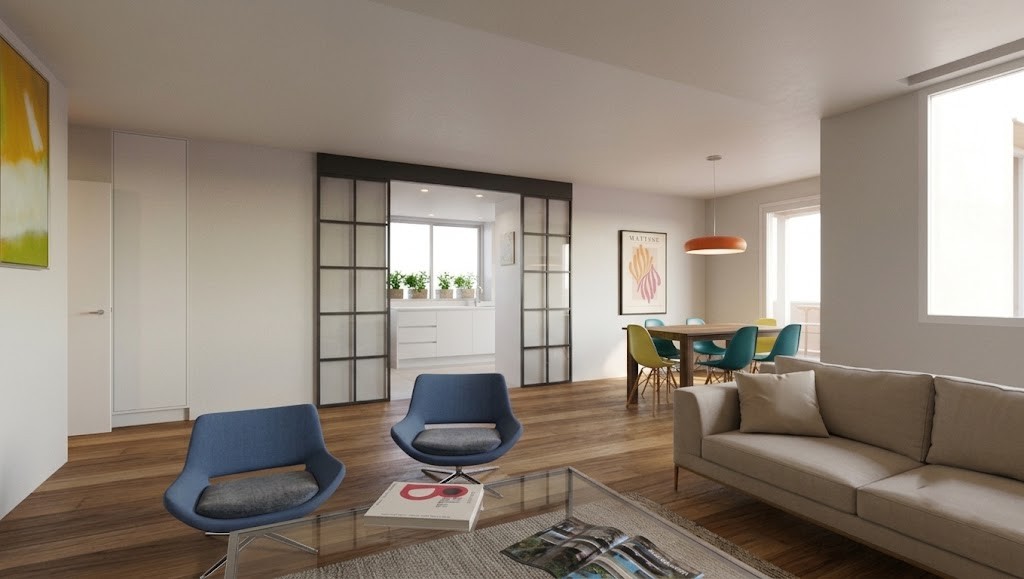 Perspectiva de salón con puerta corredera de vidrio y hierro que da acceso a cocina reformada en Madrid, con zona de comedor y suelo de madera, por Espacio Acorde.